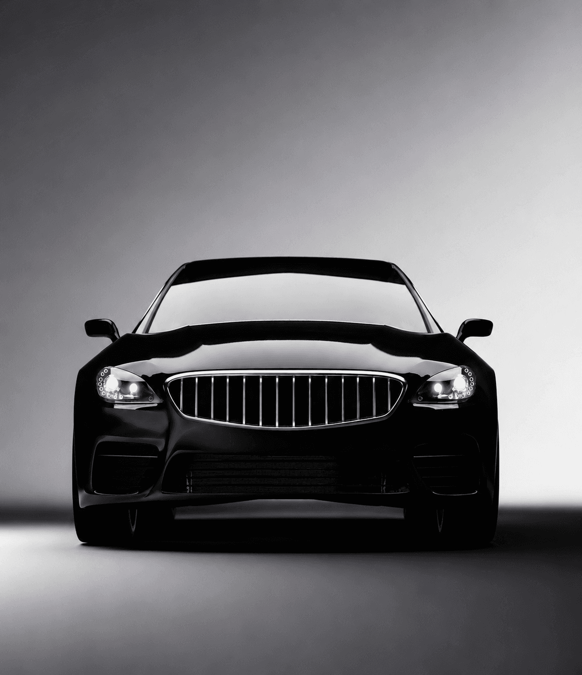 A silver sports car parked in a dimly lit garage